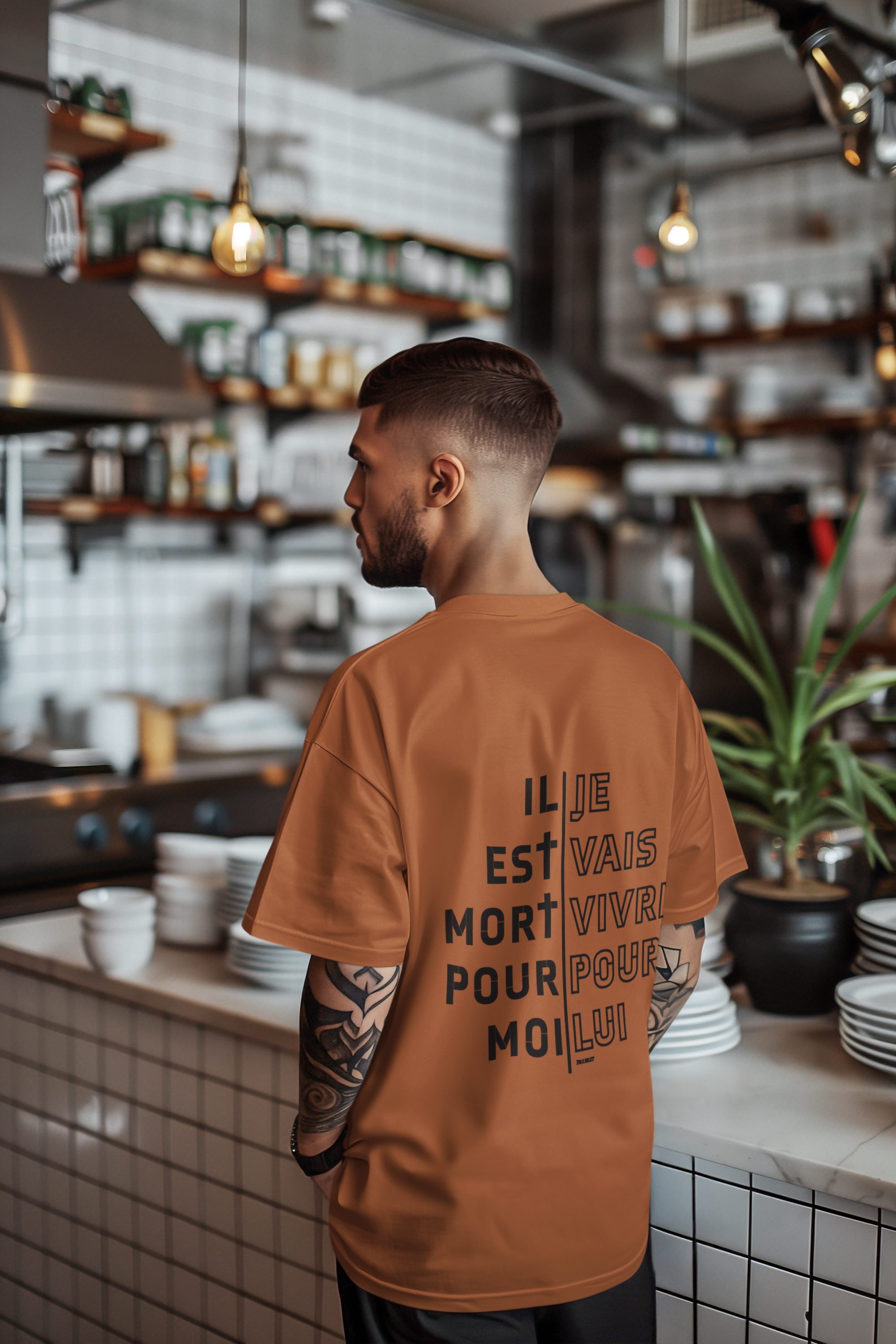 back-view-t-shirt-mockup-featuring-an-ai-created-tattooed-man-in-a-restaurant-m51348
